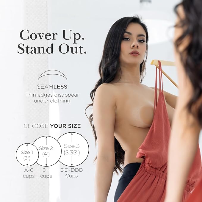 Woman wearing nipple covers with seamless edges holding a red dress, sizing guide included