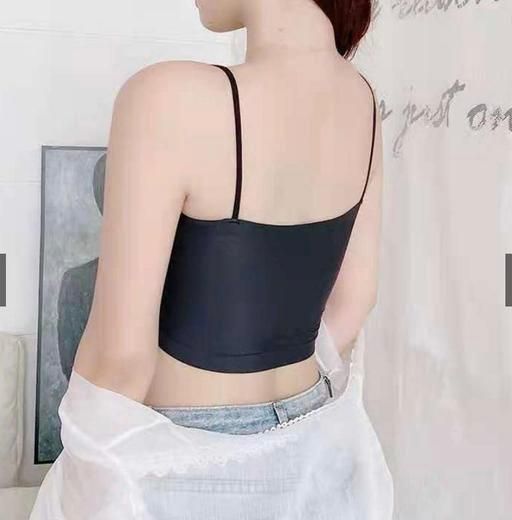 Back view of woman wearing black crop top from comfortable lingerie pack with thin straps