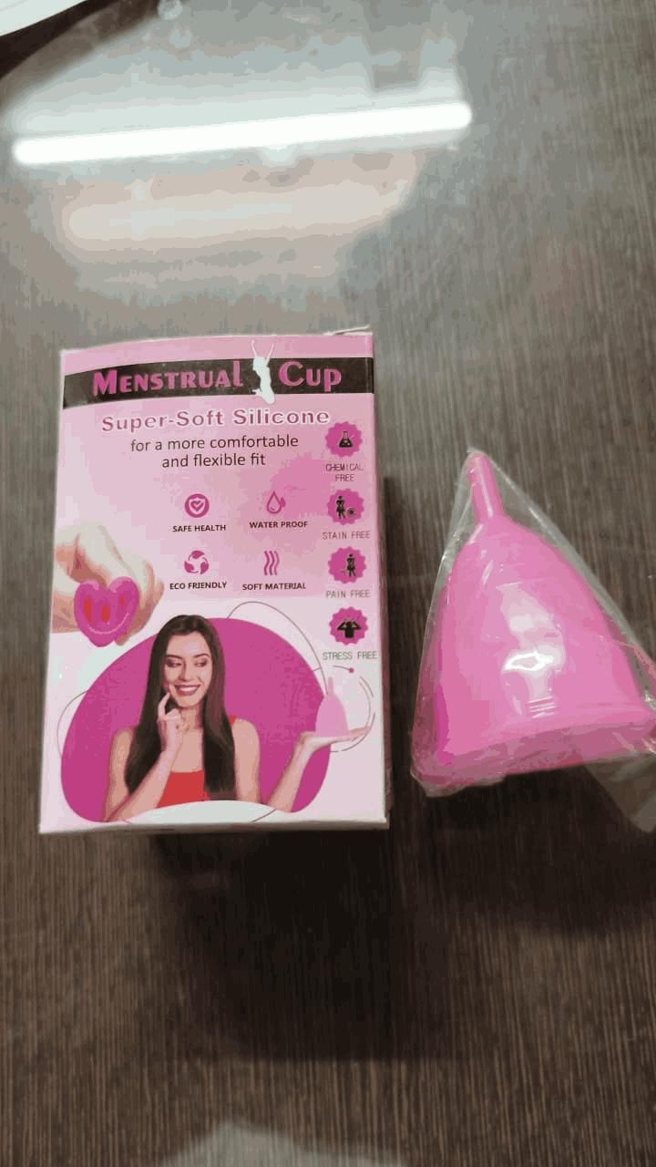 Pink menstrual cup made of super soft silicone next to its pink and white packaging box