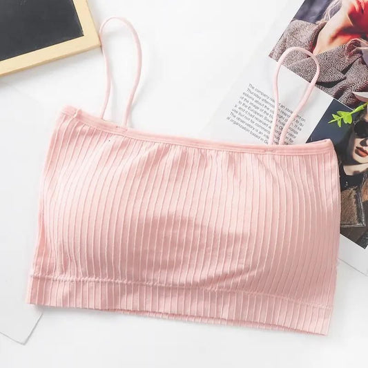 Light pink ribbed soft bralette for women with thin adjustable straps on white background