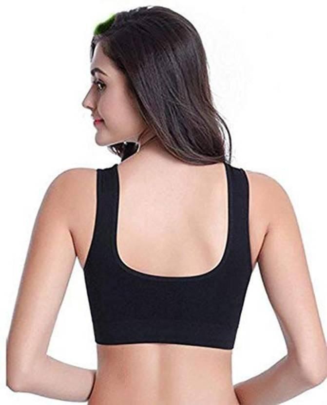 Woman wearing stylish breathable bras in black with wide straps for comfort and support