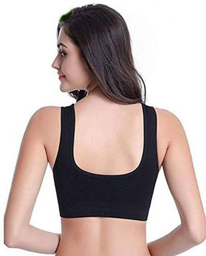 Woman wearing stylish breathable bras in black with wide straps for comfort and support