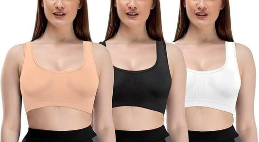 Set of three stylish breathable bras in peach, black, and white colors worn by model